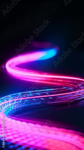 A vibrant, neon light trail weaves through darkness, with blue and pink hues. Abstract, futuristic imagery