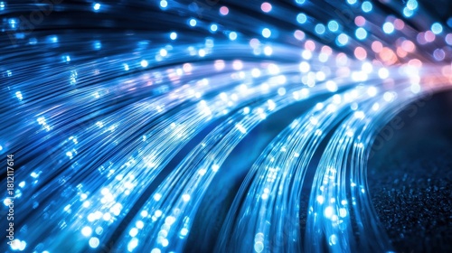 Fiber detail shot curved arrangement multiple optical fibers showing bright blue light transmission patterns through glass strands
