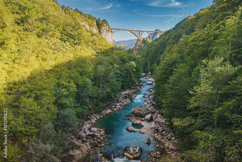 Quadro su tela Iconic arched bridge crossing a deep Tara river canyon surrounded by lush green