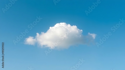 Single fluffy cloud in a vast blue sky, serene atmosphere.