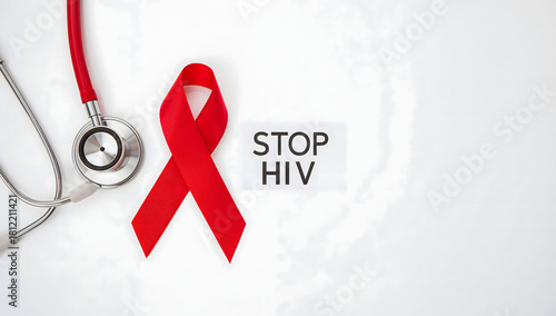 Stop HIV awareness concept with a red ribbon and stethoscope on a white background, a symbol of solidarity for World AIDS Day