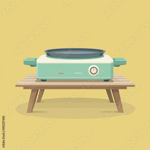 Flat illustration of a portable electric griddle on a table
