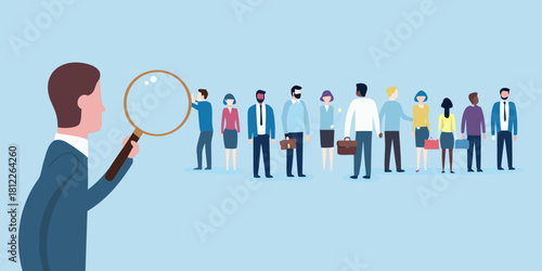 Magnifying glass examines diverse group of business people