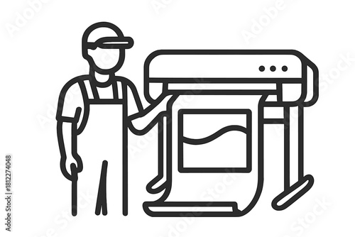 Print shop worker operating a large plotter printing a graphic design