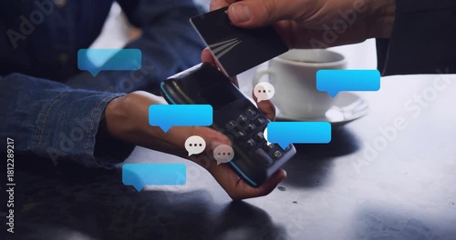 Cashier holding terminal and rotating it while customer tapping card, sparking payment chat bubbles