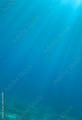 Ocean underwater rays of light background, under blue water sunlight. Underwater background, ocean or sea surface seen from under water. Rays of light beams, abstract marine backdrop. Nature landscape