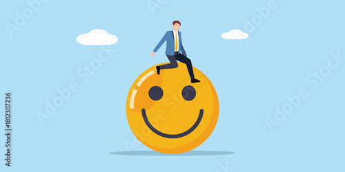 Businessman riding a giant happy face symbol