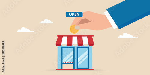 Hand drops coin into open store for business investment