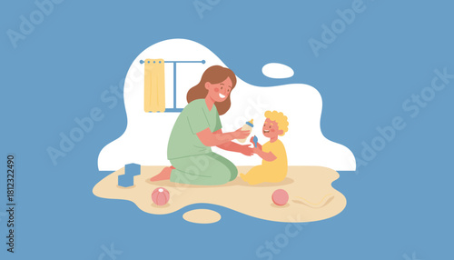 Caring mother feeding her smiling toddler boy during playtime Childhood parenting bonding