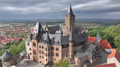 Wernigerode Castle in Harz Mountain range, Moody Aerial view at Dramatic Weather, Saxony-Anhalt, Germany.