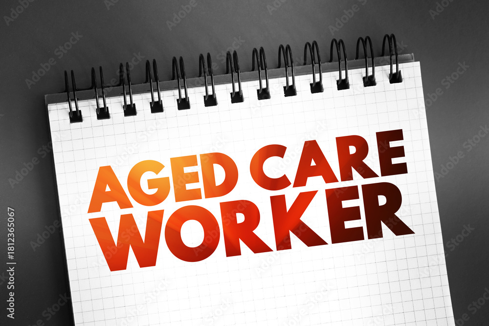 Fototapeta premium Aged care worker - provides personal, physical and emotional support to older people who require assistance with daily living, text on notepad