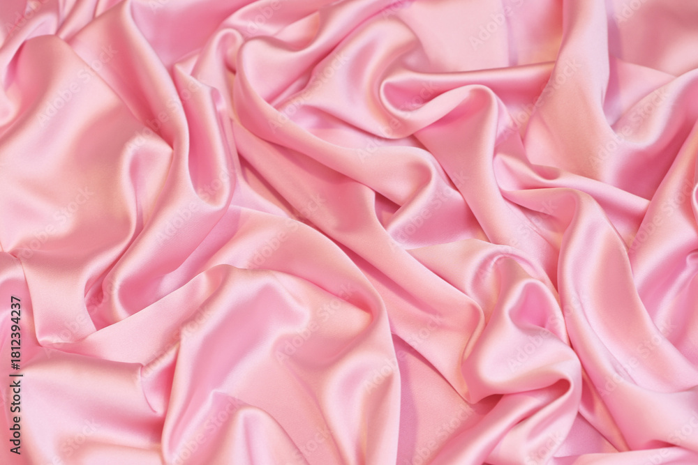 Obraz premium Close-up of soft, flowing baby pink Charmeuse satin texture. Ideal luxurious background for high-end fashion, beauty, or celebration themes.