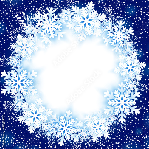 Festive winter background with a circular frame made of white snowflakes on blue backdrop