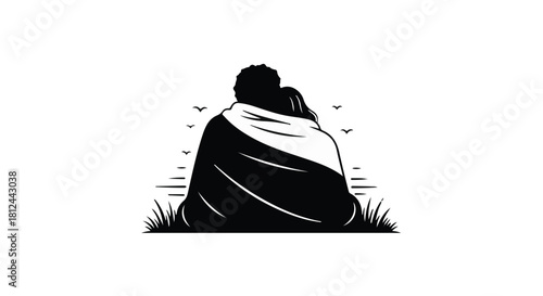 Embracing couple sharing a blanket outdoors with birds flying overhead.