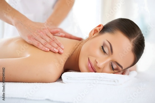 Woman receiving back massage at spa for relaxation and wellness therapy