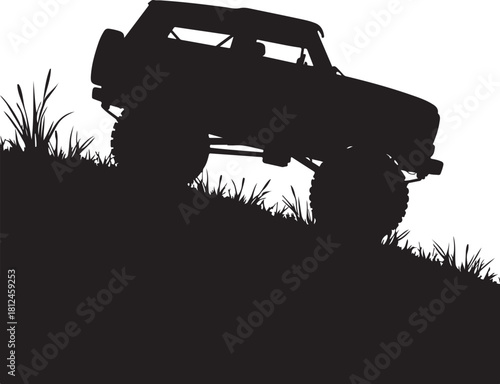 Black silhouette of off road vehicle on grassy hill