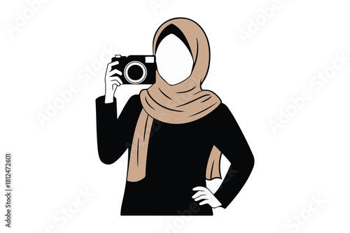 Woman in hijab taking a photo with a vintage camera
