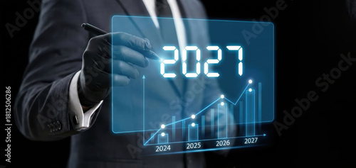 2027 year Business Growth Chart – Business man -Digital Blue Hologram Presentation on Black Background