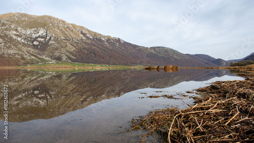reflection of mountain on the lake in the morning