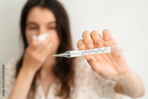 Woman Showing Thermometer