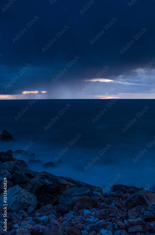 Fototapeta premium Rain in the evening above the horizon of the Adriatic Sea, Montenegro