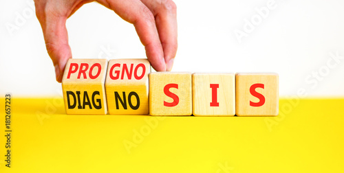 Prognosis or diagnosis symbol. Concept words Prognosis or Diagnosis on beautiful wooden blocks. Beautiful white background. Doctor's hand. Business prognosis or diagnosis concept. Copy space.