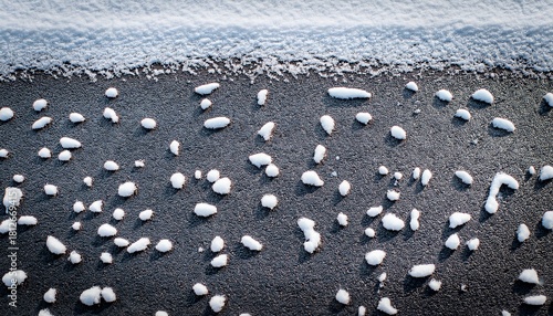 The Texture Of Asphalt Covered With Snow With Small Stones