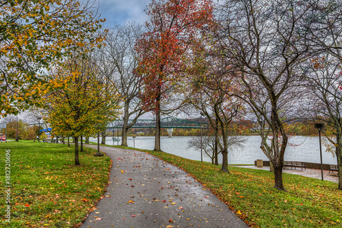David Harris Riverwalk A hiking trail following the Ohio River in Huntington WV on a rainy October afternoon.  Heading to the Robert C. Byrd Bridge.