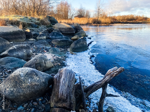 Winter landscape. The shore of Lake Onega covered with the first ice. Karelia
