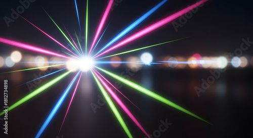 Colorful abstract light beams with bokeh effect in dark background