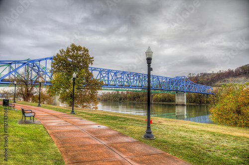 Ashland River Trail Along the Ohio River. The Ashland Kentucky Riverfront Trail  follows the Ohio River to the Simeon Wills Memorial Bridge on a cloudy autumn morning. 