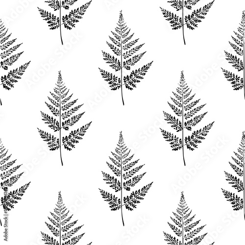 Seamless pattern of black fern leaves on a white background creating a nature inspired backdrop design element