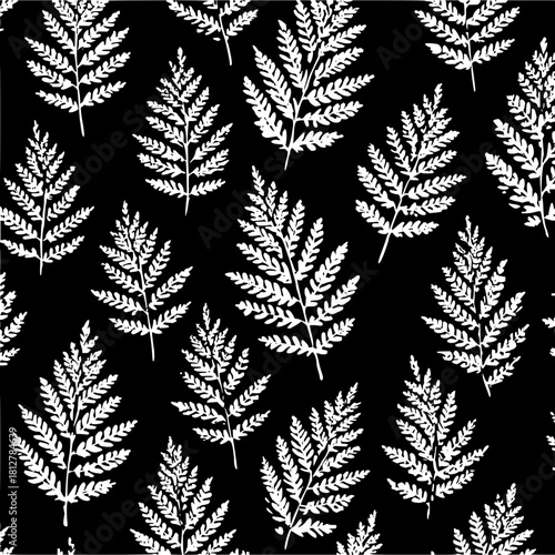Fern fronds in a seamless pattern with a black background and white leaves creating a botanical design look