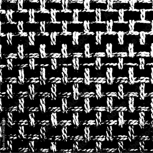 Close up of a black and white woven fabric texture creating a crosshatch pattern throughout the image