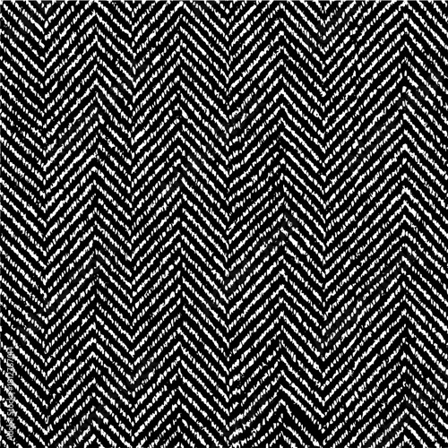 Black and white herringbone pattern creating a zigzag design with textured lines and rough edges effect