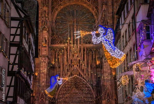 Fototapeta Naklejka Na Ścianę i Meble -  Festive decorations at the famous Strasbourg Cathedral, France, Christmas Market