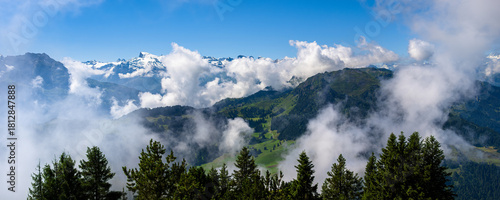 Tableau sur toile Panoramic Mountain View at Stanserhorn, Switzerland, with Clouds and Pine Trees