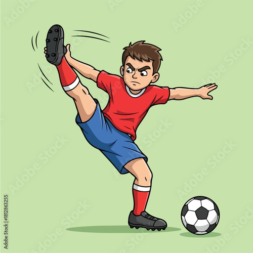 Young boy in red shirt and blue shorts playing soccer kicking the ball with intense focus and determination.