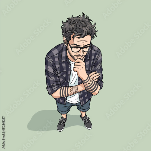 Thoughtful young man in glasses and plaid shirt contemplating.