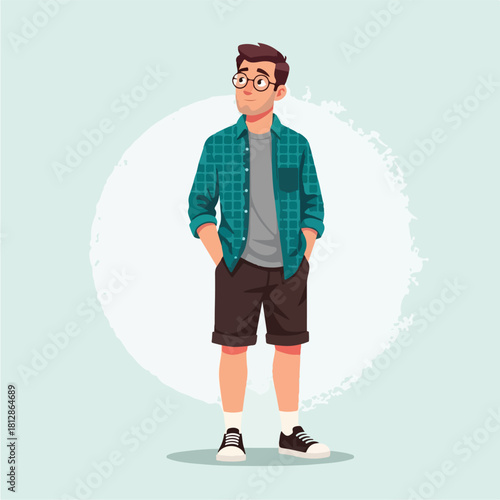 Young man with glasses in casual attire standing confidently.