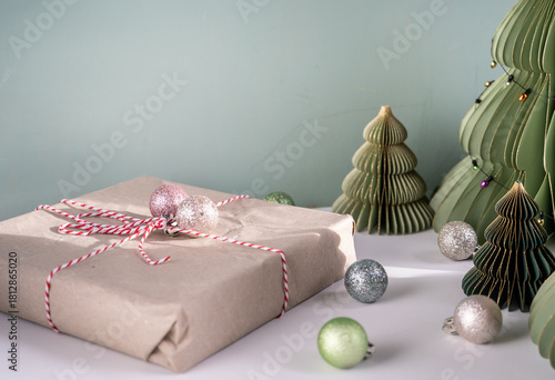 Gift Wrapped in Brown Paper with Red String, Holiday Decor and Mini Paper Christmas Trees