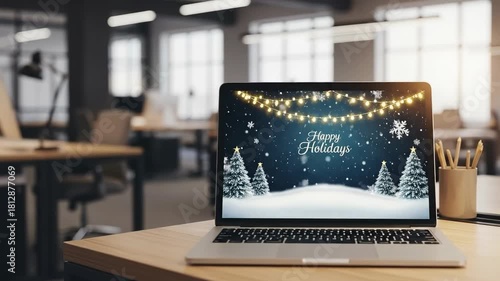 Modern office desk with a laptop displaying a festive 'Happy Holidays' winter scene, featuring snow, trees, and string lights, set in a contemporary workspace.