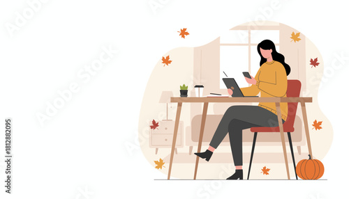 Cozy fall remote work Woman uses phone and tablet at a desk surrounded by autumn leaves and a pumpkin