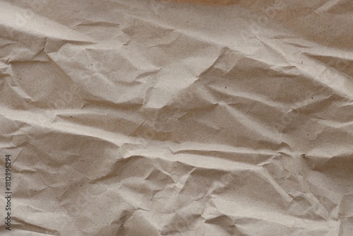 Brown crumpled recycled paper texture background. Kraft Paper