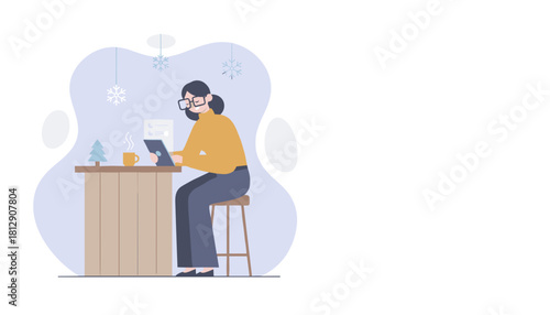 Woman working on a tablet with coffee in a cozy winter environment remote work concept