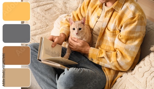 Young man with cute cat rea...