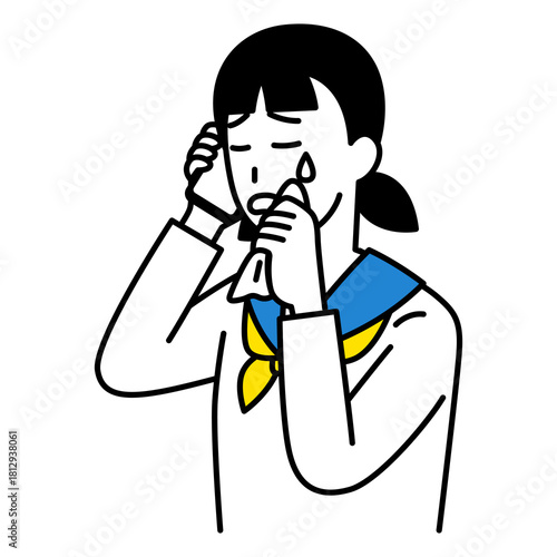 スマートフォンでの通話で泣く女子学生