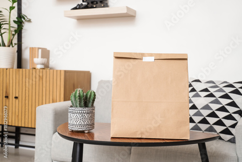 Paper bag with cactus on ta...