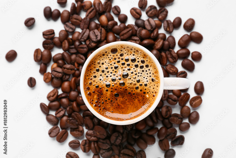 Obraz premium Coffee beans and cup of coffee on white background