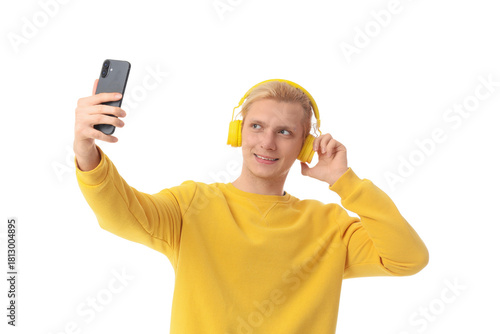 Young blonde man in headpho...